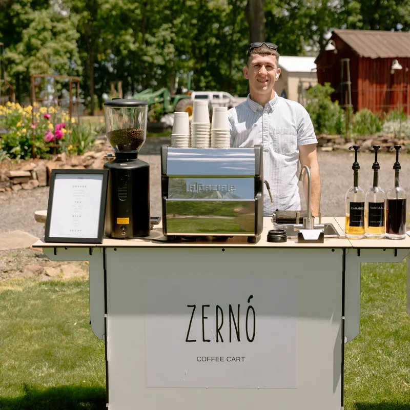 Custom branded coffee cups at a brand activation