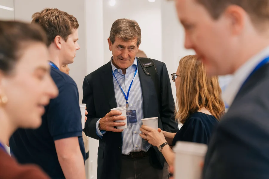 Conference attendees networking over coffee