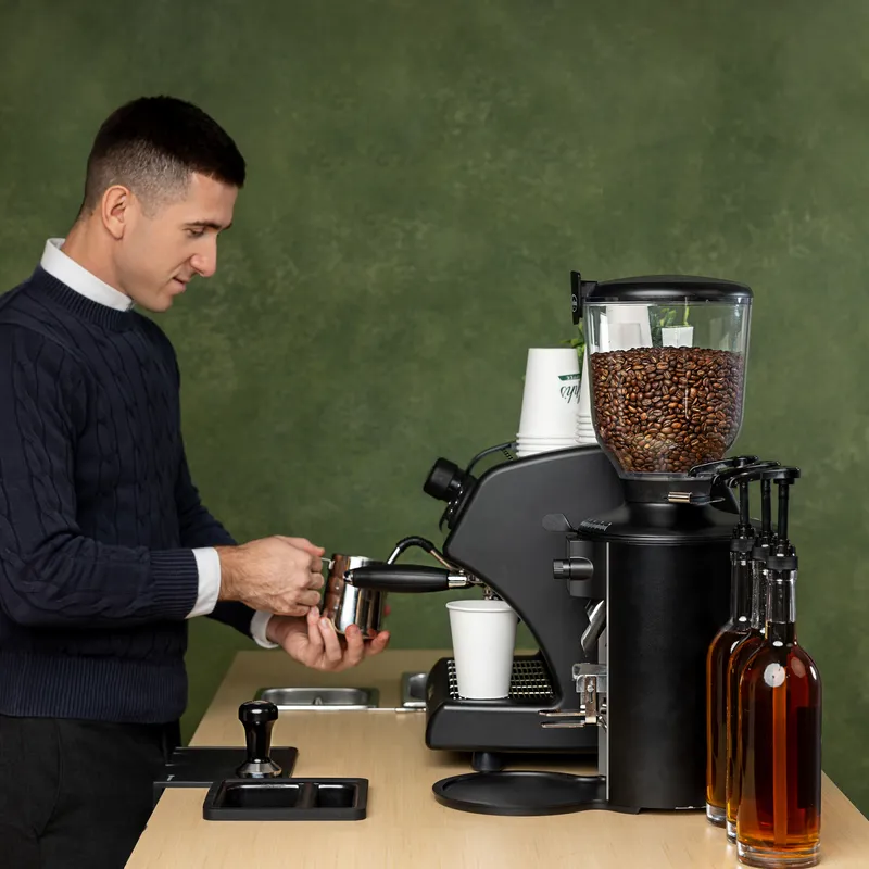 Barista preparing specialty espresso at the cart