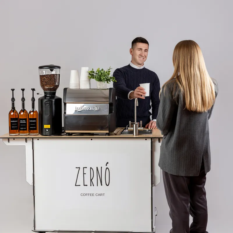 Barista serving a guest at a catered event