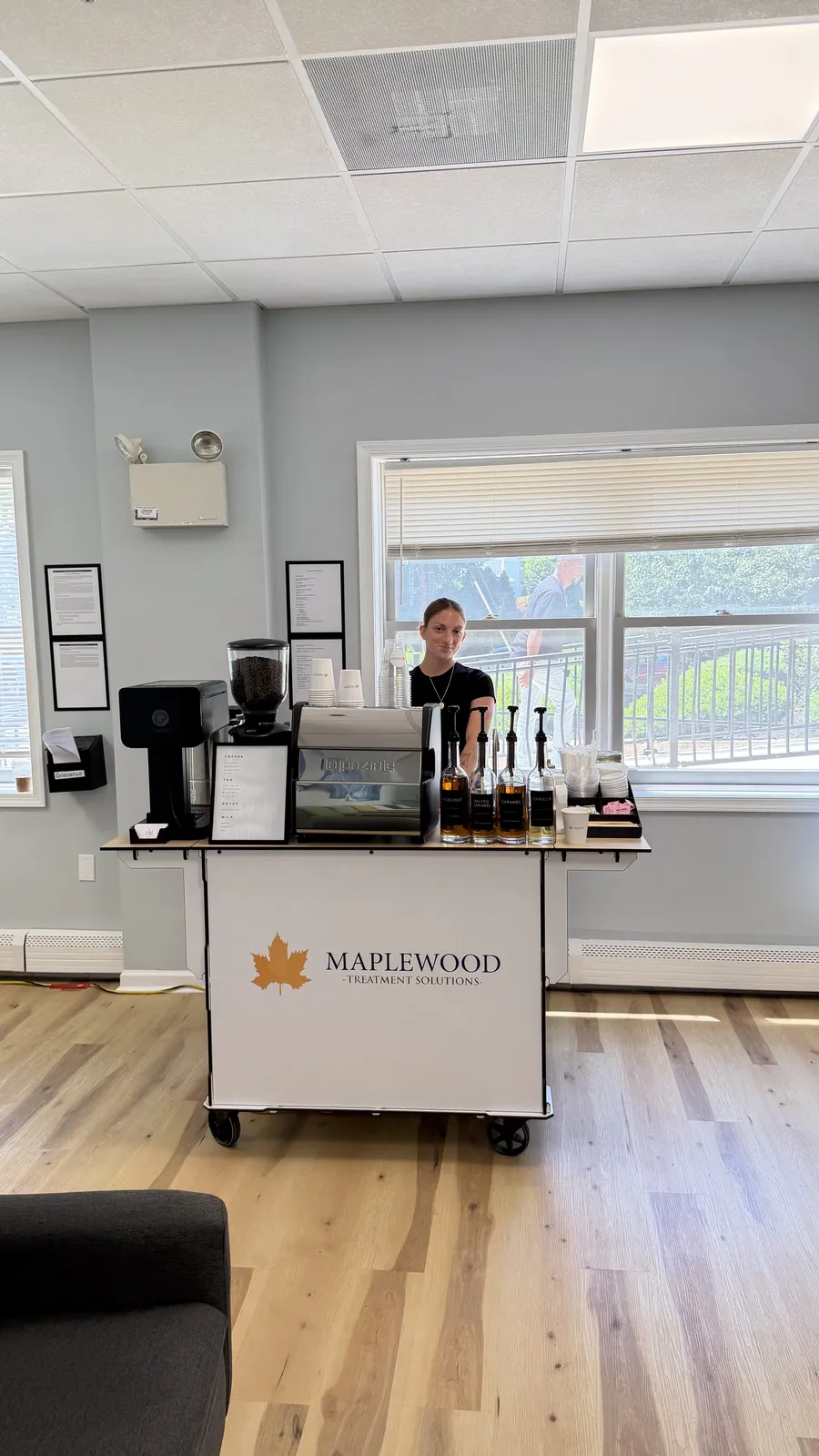 Branded Zerno coffee cart serving at an office event